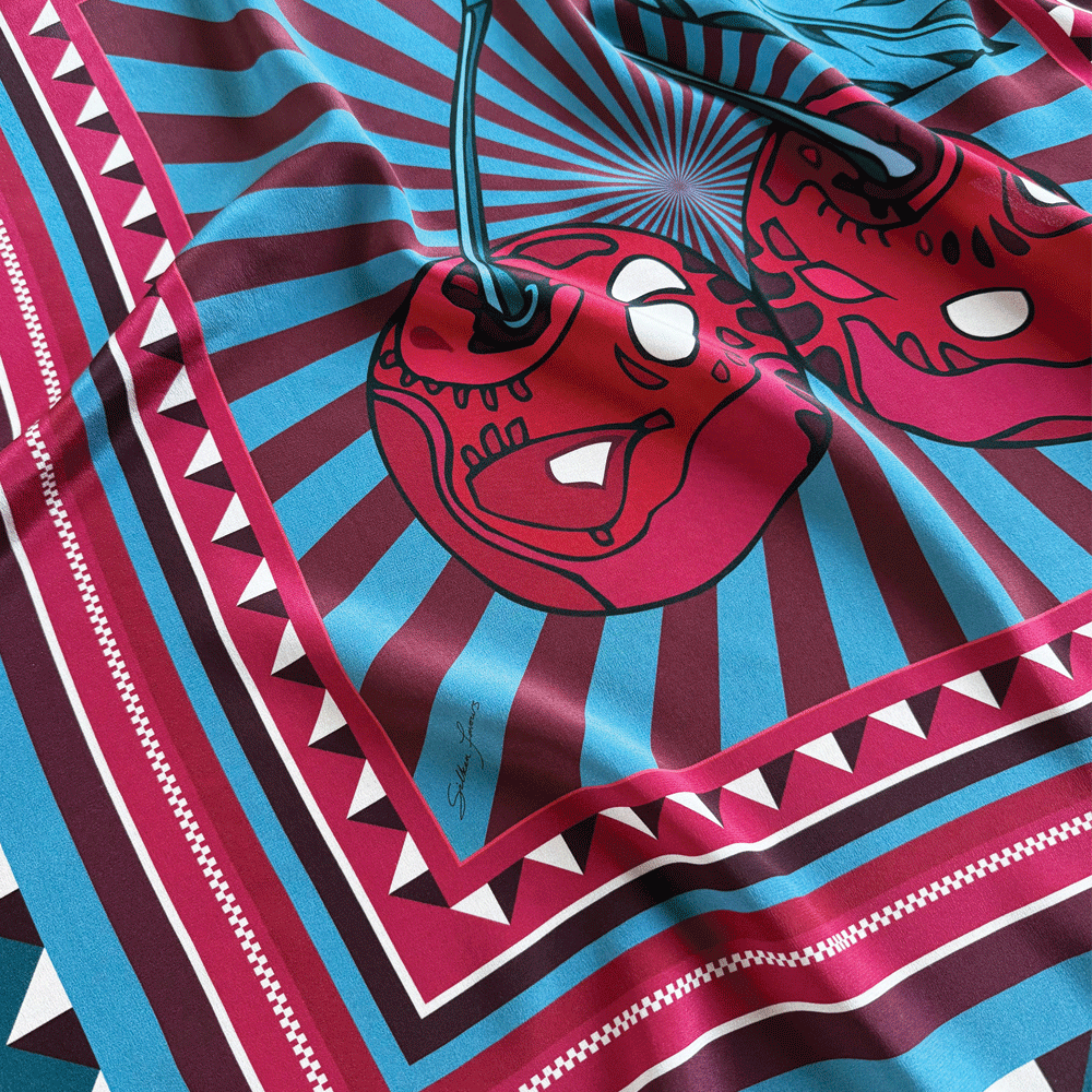 Blue Cherry Pop silk scarf by Silken Favours — bold red and blue graphic cherry print, made in Britain